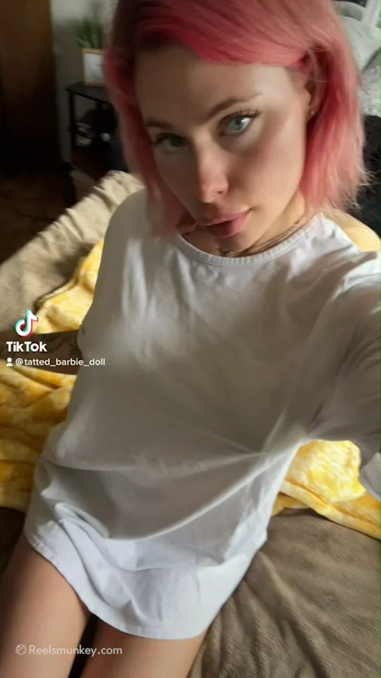 Super hot babe goes down to the bed naked gives a flash of those big TikTok Tits