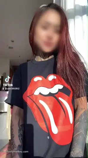 Heavy tattooed girl with sexy piercing reveals her pretty boobs in slow mo