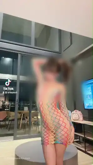 Petite girl wearing a see through fish net dress reveling her pussy on TikTok