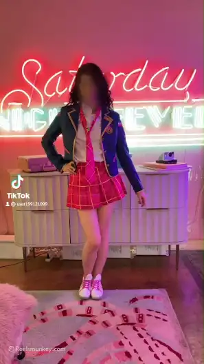 Pretty girl drops her Japanese school girl costume one by one