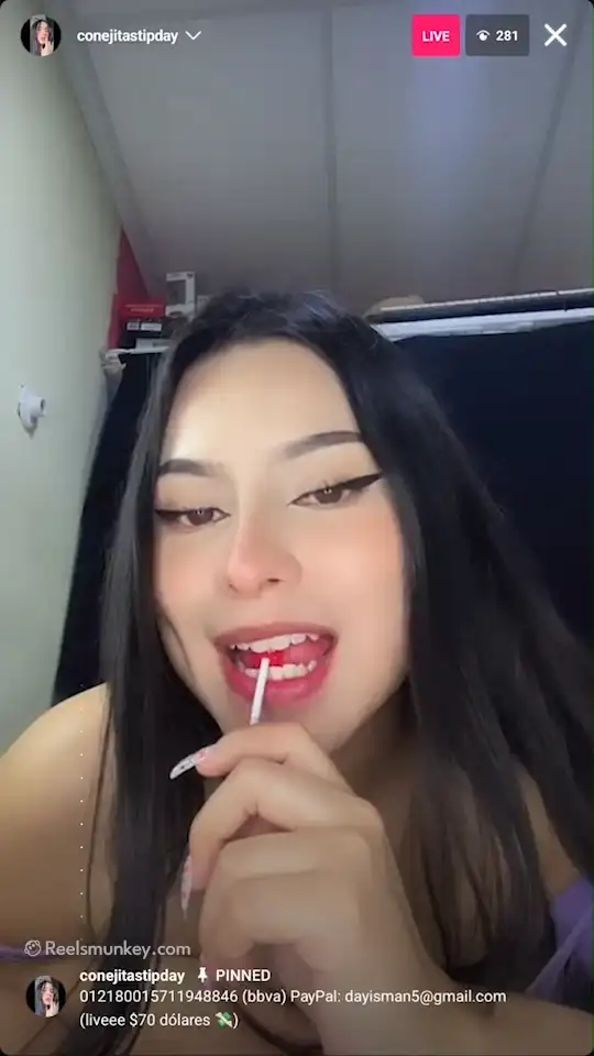 Sexy Latina teasing you with red lollypop in her fish net dress